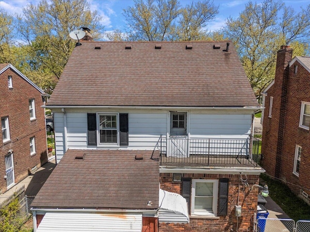 5921 Hillcrest St, Grosse Pointe, MI 48236 - back of house featuring a balcony and a shingled roof