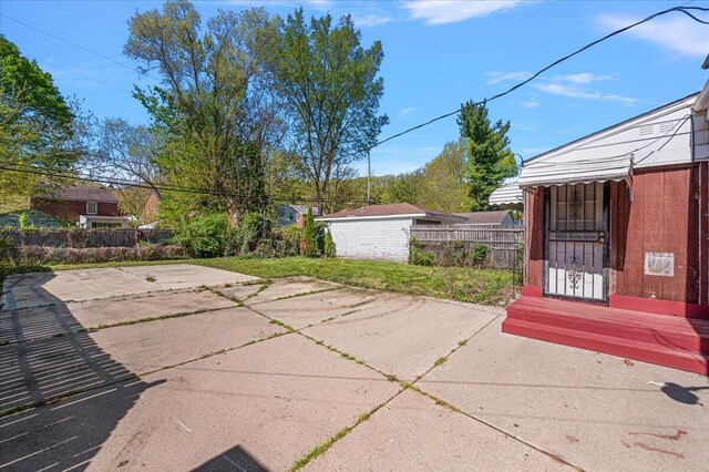 5921 Hillcrest St, Grosse Pointe, MI 48236 - view of patio / terrace featuring fence and an outdoor structure