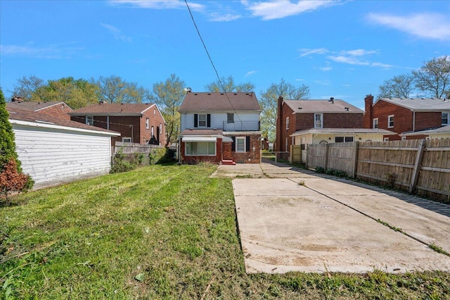 5921 Hillcrest St, Grosse Pointe, MI 48236 - rear view of house featuring brick siding and a residential view