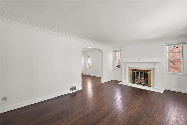 5921 Hillcrest St, Grosse Pointe, MI 48236 - unfurnished living room featuring arched walkways, ornamental molding, wood finished floors, a fireplace, and baseboards