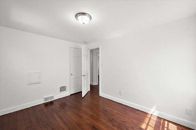 5921 Hillcrest St, Grosse Pointe, MI 48236 - unfurnished bedroom with baseboards, wood finished floors, and a closet