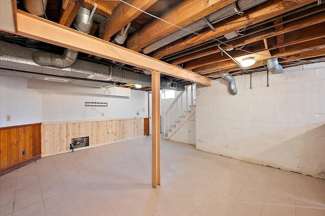 5921 Hillcrest St, Grosse Pointe, MI 48236 - below grade area with stairway, a wainscoted wall, tile patterned floors, and wooden walls