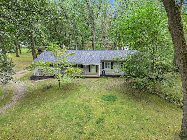 13195 Rainbow Dr, Gregory, MI 48137 - view of front facade with a shingled roof, a chimney, a front lawn, covered porch, and driveway