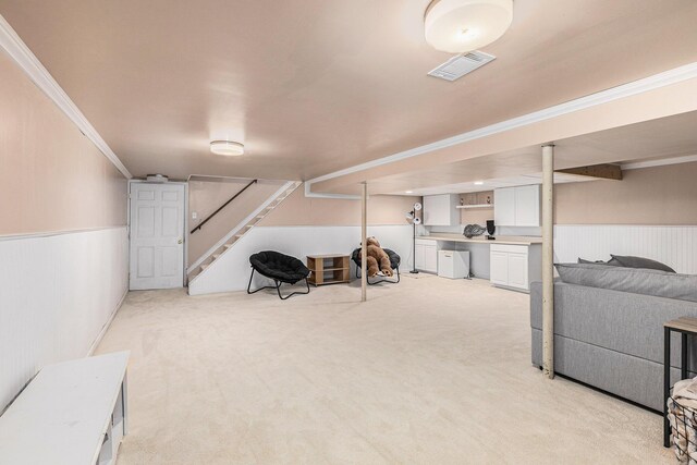 13195 Rainbow Dr, Gregory, MI 48137 - finished basement featuring wainscoting, light carpet, ornamental molding, and stairway