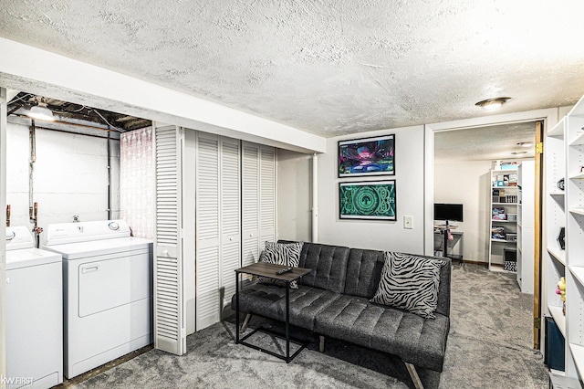 1566 Snyder Rd, East Lansing, MI 48823 - living area with washer and dryer, a textured ceiling, and unfinished concrete floors
