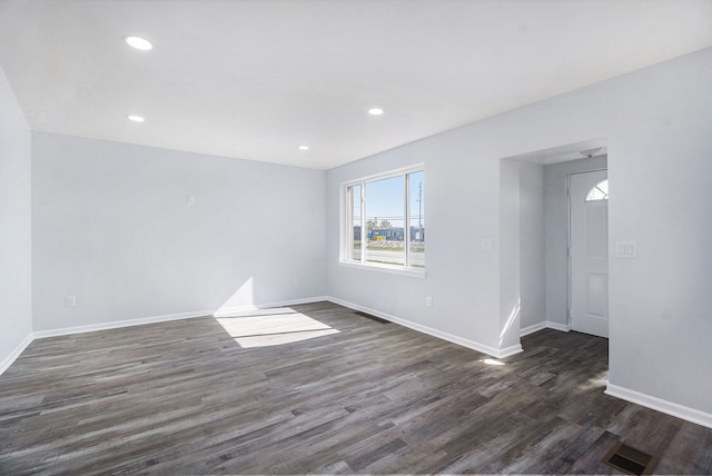34641 Mound Rd, Sterling Heights, MI 48310 - empty room featuring dark wood-type flooring, baseboards, and recessed lighting
