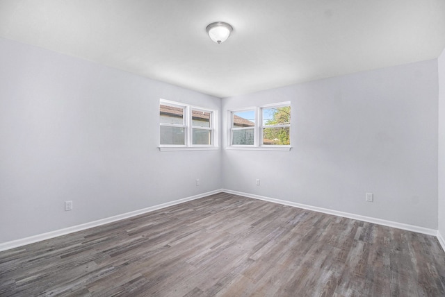 34641 Mound Rd, Sterling Heights, MI 48310 - empty room featuring dark wood-style flooring and baseboards