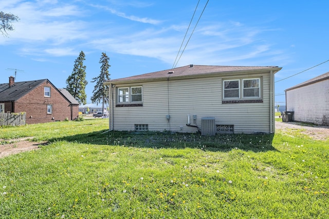 34641 Mound Rd, Sterling Heights, MI 48310 - back of property with a yard and central air condition unit