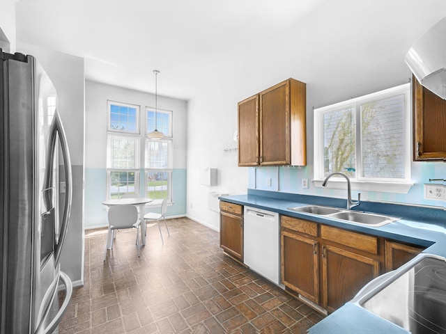 3201 Kilburn Park Cir, Ann Arbor, MI 48105 - kitchen with a sink, white dishwasher, stainless steel fridge, brick patterned flooring, and baseboards