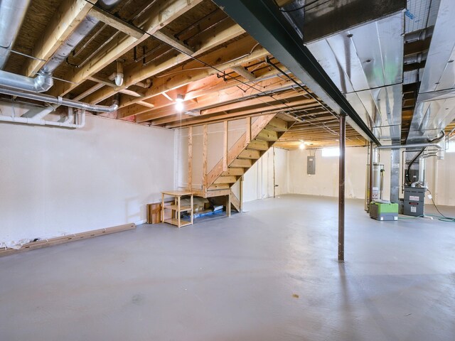 3201 Kilburn Park Cir, Ann Arbor, MI 48105 - unfinished basement with stairs, heating unit, and electric panel