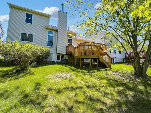 3201 Kilburn Park Cir, Ann Arbor, MI 48105 - back of property with stairway, cooling unit, a chimney, a wooden deck, and a yard