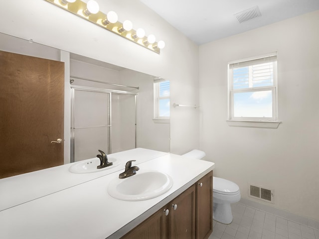 3201 Kilburn Park Cir, Ann Arbor, MI 48105 - bathroom featuring a stall shower, vanity, toilet, tile patterned floors, and baseboards