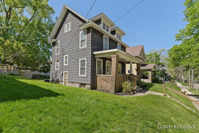 106 Colfax St NE, Grand Rapids, MI 49505 - view of property exterior featuring a lawn