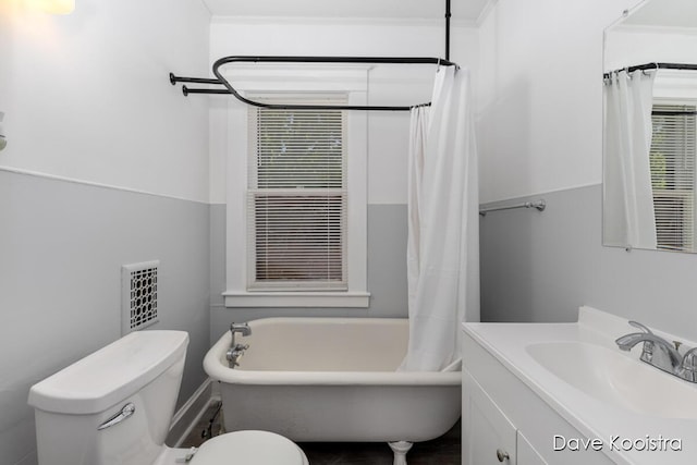 106 Colfax St NE, Grand Rapids, MI 49505 - bathroom featuring a bath, toilet, vanity, and a shower with shower curtain