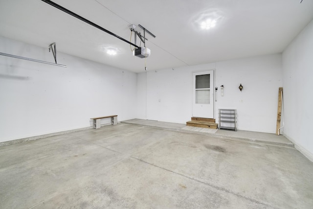 1972 Pine Ridge Dr, Manistee, MI 49660 - garage featuring a garage door opener