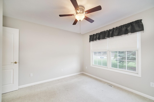 1972 Pine Ridge Dr, Manistee, MI 49660 - empty room featuring carpet floors, baseboards, and ceiling fan