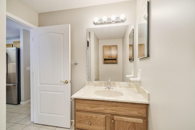 1972 Pine Ridge Dr, Manistee, MI 49660 - bathroom featuring tile patterned floors and vanity