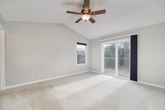 1972 Pine Ridge Dr, Manistee, MI 49660 - spare room with a ceiling fan, lofted ceiling, baseboards, and light carpet