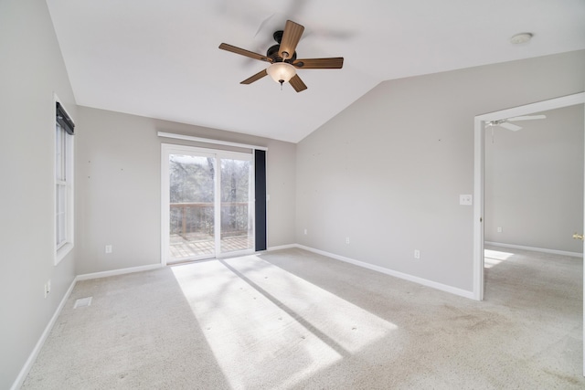1972 Pine Ridge Dr, Manistee, MI 49660 - unfurnished room featuring a ceiling fan, lofted ceiling, light carpet, and baseboards