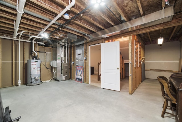 1972 Pine Ridge Dr, Manistee, MI 49660 - unfinished basement featuring gas water heater and heating unit