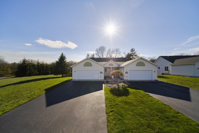 1972 Pine Ridge Dr, Manistee, MI 49660 - ranch-style house featuring a front lawn, driveway, and an attached garage