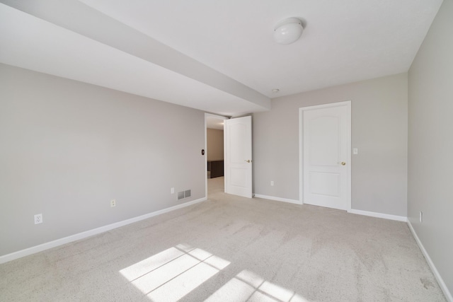 1972 Pine Ridge Dr, Manistee, MI 49660 - unfurnished bedroom featuring baseboards and light carpet