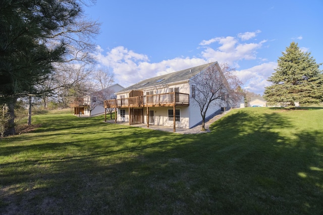 1972 Pine Ridge Dr, Manistee, MI 49660 - rear view of property with a wooden deck and a lawn
