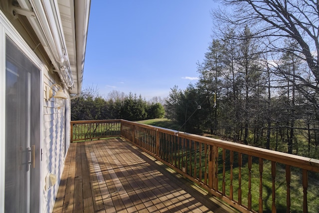 1972 Pine Ridge Dr, Manistee, MI 49660 - wooden deck featuring view of scattered trees