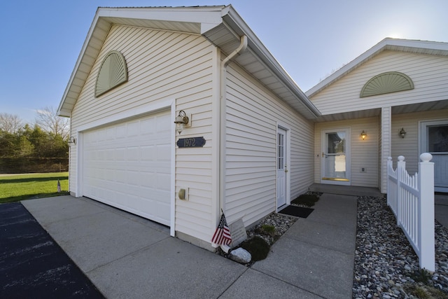 1972 Pine Ridge Dr, Manistee, MI 49660 - view of property exterior with a garage and driveway