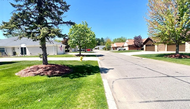 view of concrete street featuring a residential view