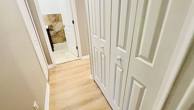 hallway featuring light wood finished floors