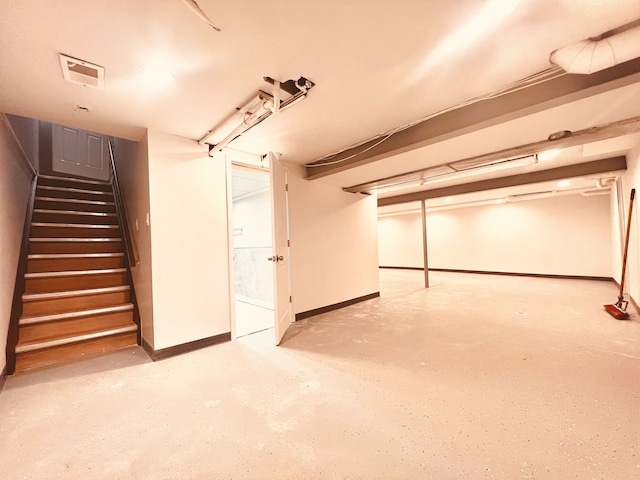 finished below grade area with stairs and baseboards