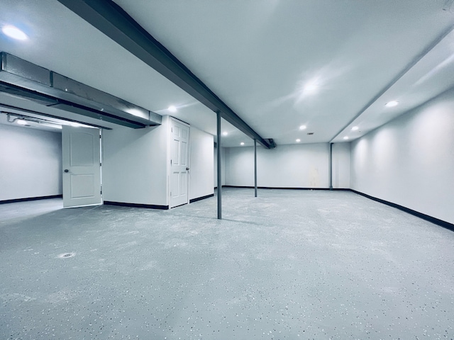 finished basement featuring recessed lighting and baseboards