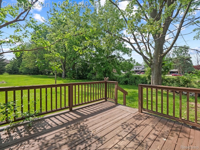 43667 Dequindre Rd, Troy, MI 48085 - wooden deck with a yard and view of wooded area