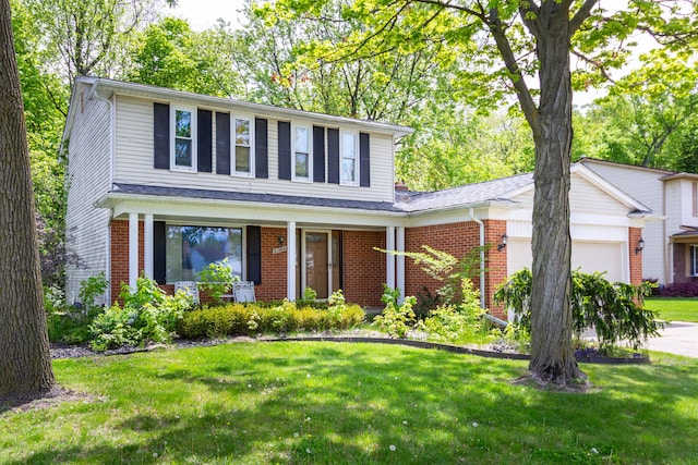 21964 Sunrise Blvd, Novi, MI 48375 - traditional-style house featuring a garage, brick siding, and a front yard