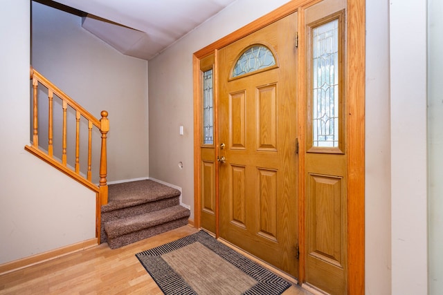 21964 Sunrise Blvd, Novi, MI 48375 - foyer entrance featuring stairway, baseboards, and wood finished floors