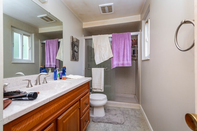 21964 Sunrise Blvd, Novi, MI 48375 - bathroom featuring a shower stall, vanity, toilet, and baseboards