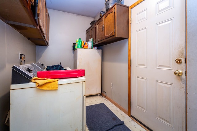21964 Sunrise Blvd, Novi, MI 48375 - laundry room featuring light flooring, cabinet space, baseboards, and independent washer and dryer