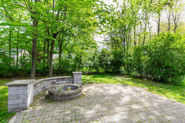 21964 Sunrise Blvd, Novi, MI 48375 - view of patio / terrace with an outdoor fire pit