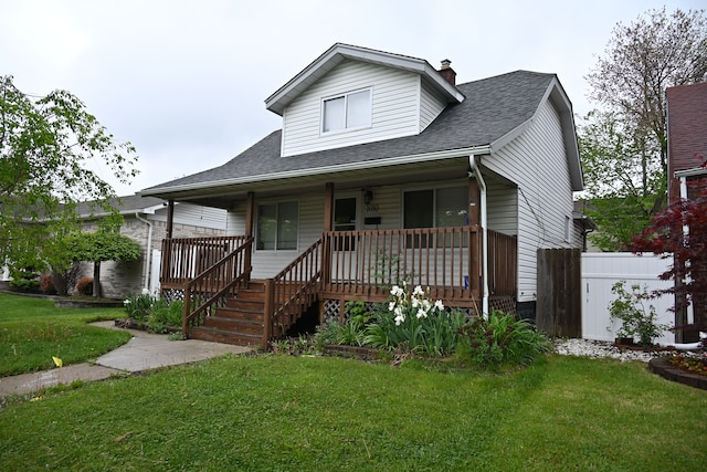 view of front of home featuring roof with shingles, covered porch, and a chimney
