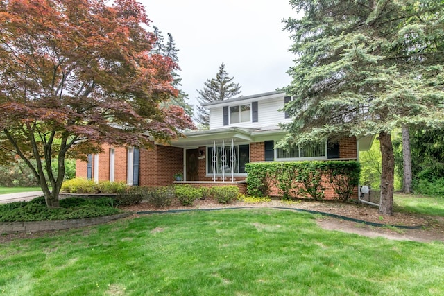 6279 Walker Ct, Troy, MI 48085 - traditional-style home with brick siding, a front lawn, and a porch