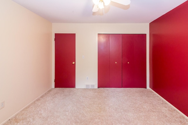 6279 Walker Ct, Troy, MI 48085 - unfurnished bedroom with carpet, a closet, and a ceiling fan