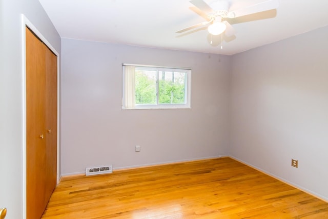6279 Walker Ct, Troy, MI 48085 - empty room with light wood finished floors, baseboards, and a ceiling fan