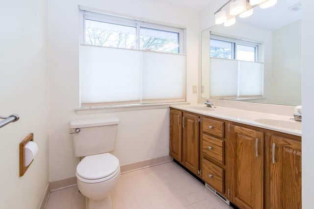 6279 Walker Ct, Troy, MI 48085 - full bath with toilet, baseboards, double vanity, and tile patterned floors