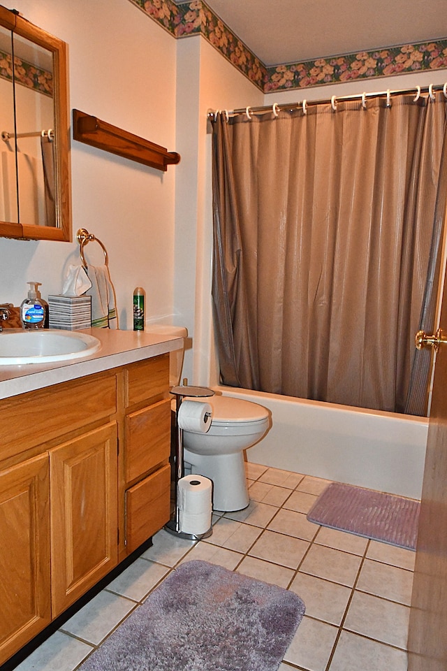 4930 Warrington Way, Gladwin, MI 48624 - bathroom featuring vanity, shower / tub combo with curtain, tile patterned flooring, and toilet