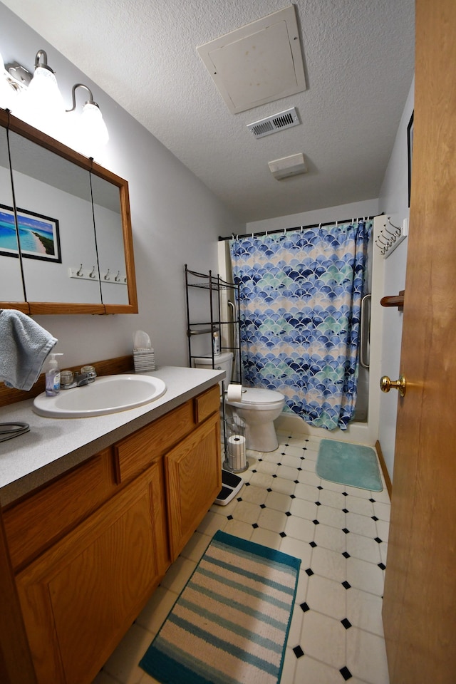 4930 Warrington Way, Gladwin, MI 48624 - bathroom with vanity, a textured ceiling, toilet, tile patterned floors, and curtained shower