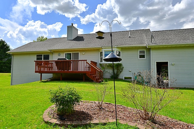 4930 Warrington Way, Gladwin, MI 48624 - back of house with a deck and a lawn
