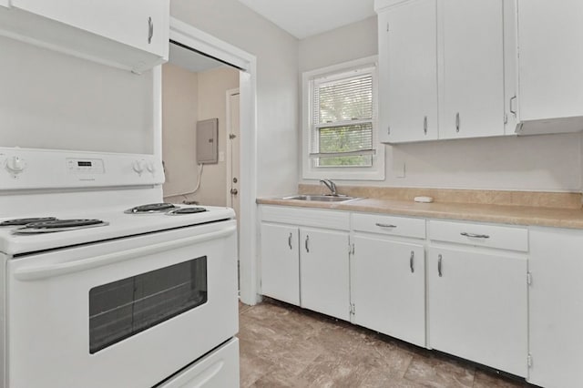 1631 Channing St, Ferndale, MI 48220 - kitchen featuring electric range, a sink, light countertops, and white cabinets