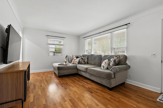 living room featuring light wood-style floors and baseboards