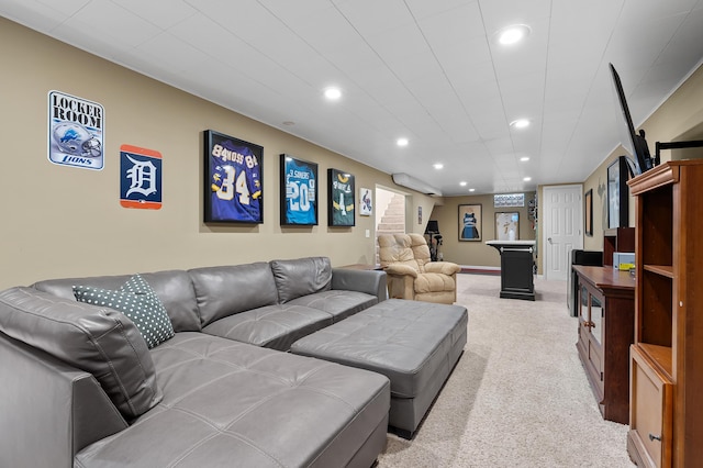 living area featuring recessed lighting, light colored carpet, and baseboards